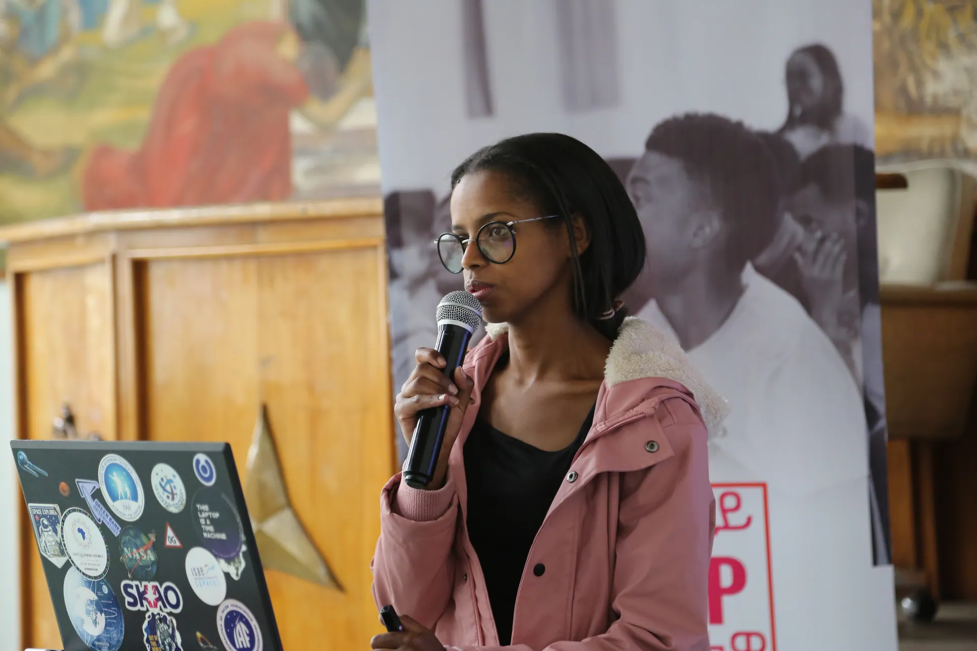 A student asks a question into the microphone